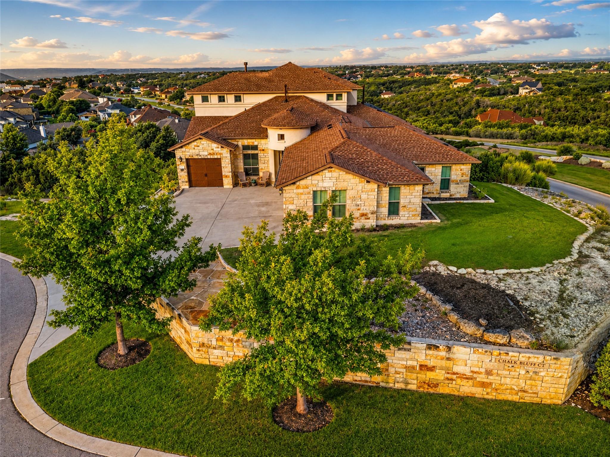 An inviting stone-clad residence with a multi-lev