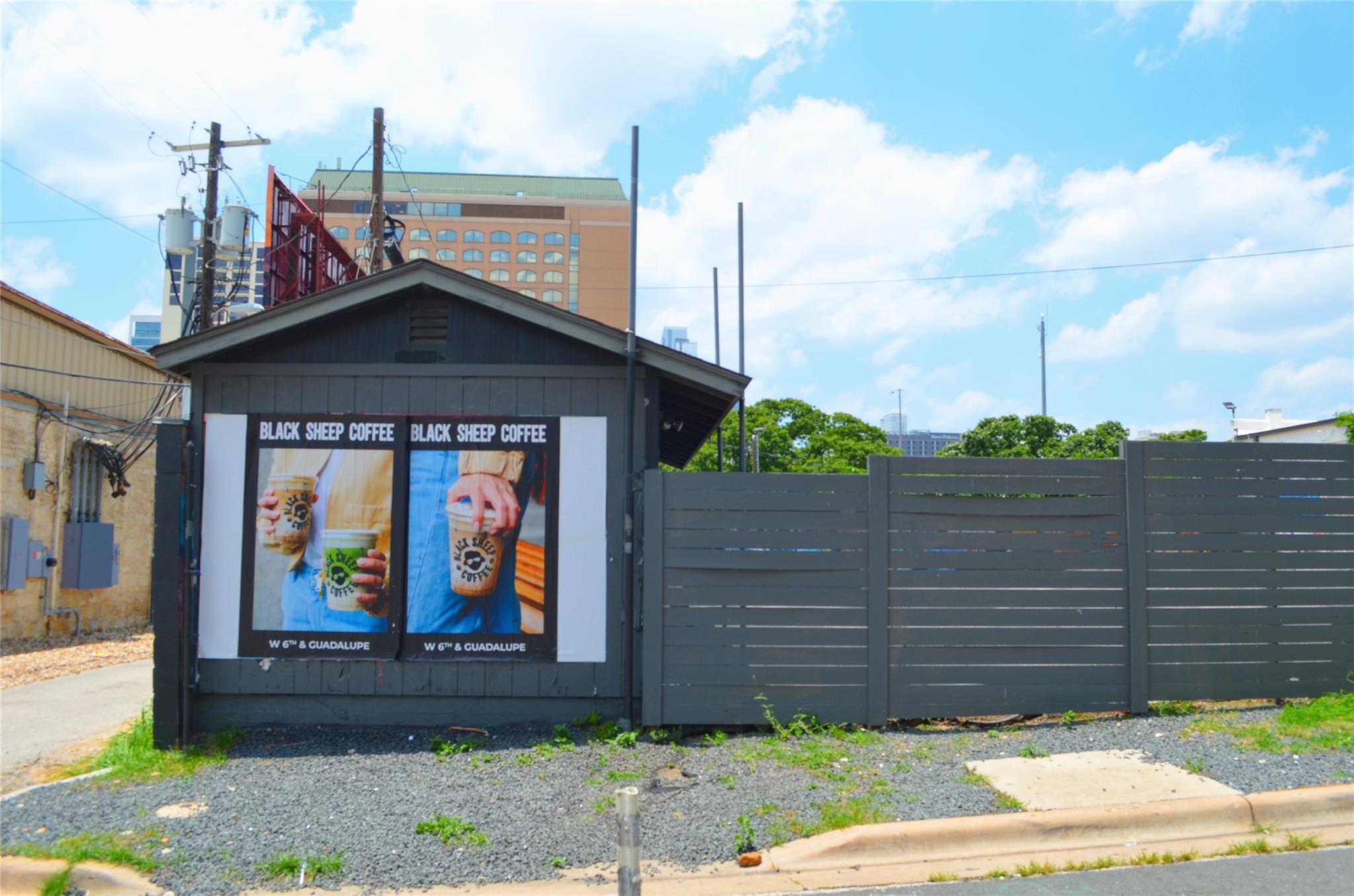 An urban lot offers potential with a partial fenc
