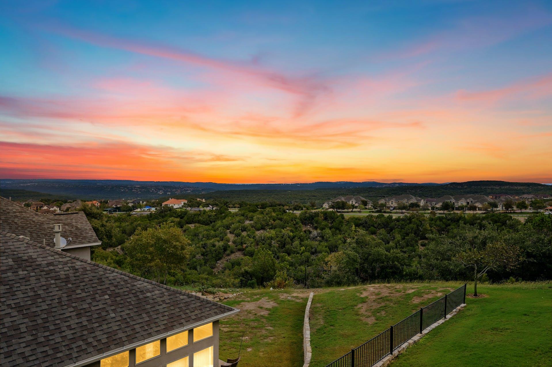 Golden hour panoramic views over the verdant hill