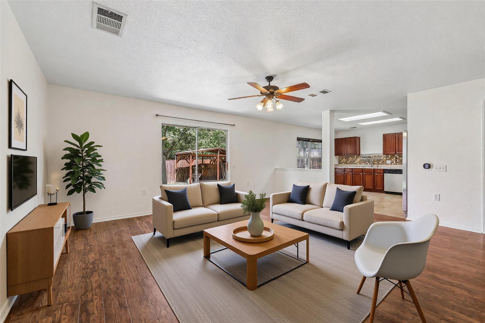 An inviting open floor plan connects the living a