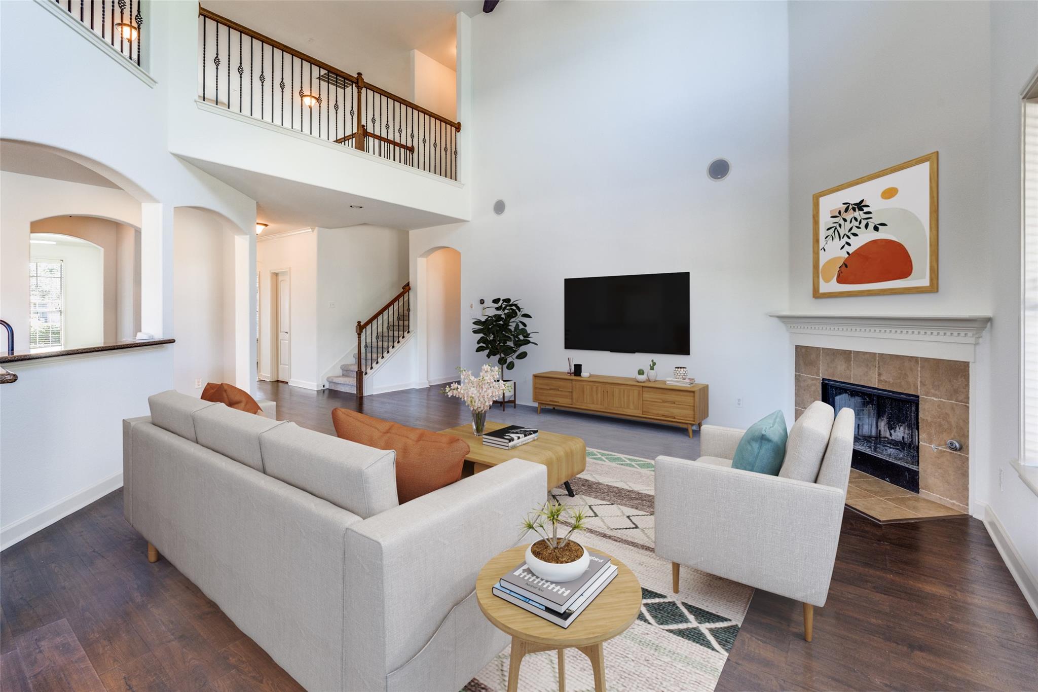 An inviting great room with soaring ceilings, a c