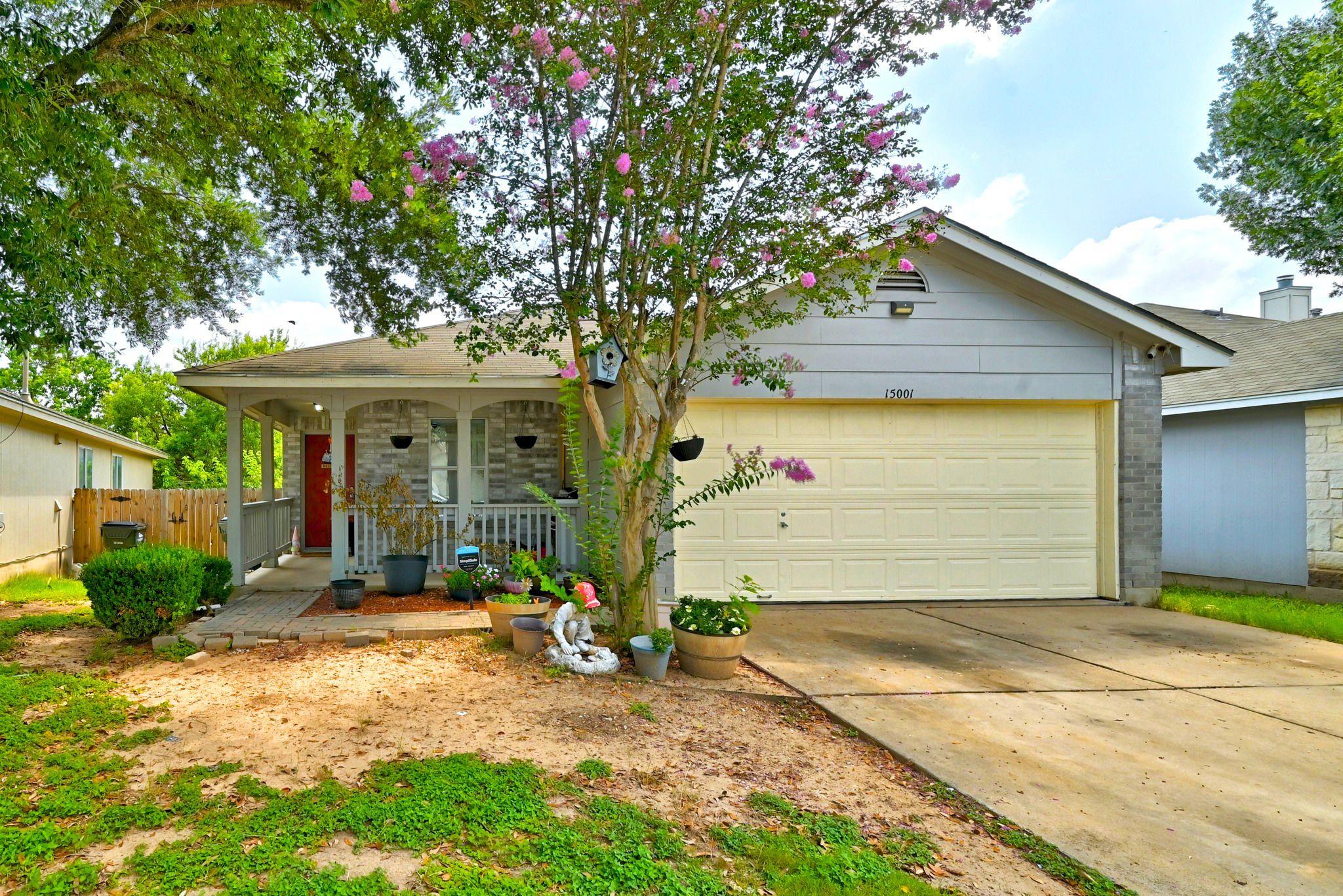 A welcoming front porch invites entry into this c