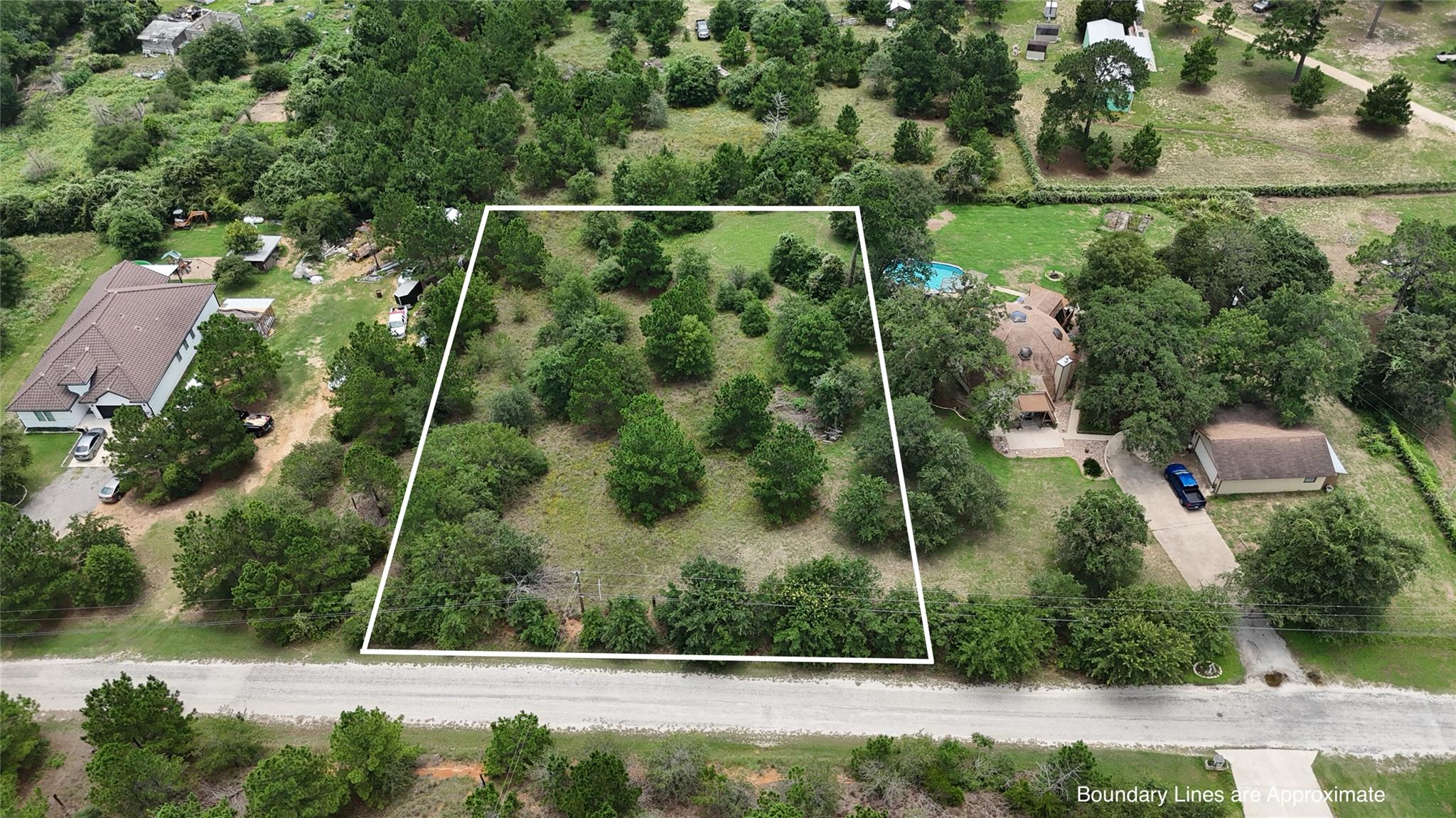 A tranquil, tree-studded lot awaits your custom h