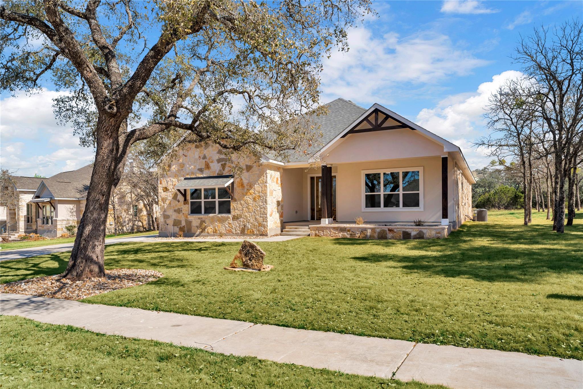 Crafted with elegant stone and stucco, this resid
