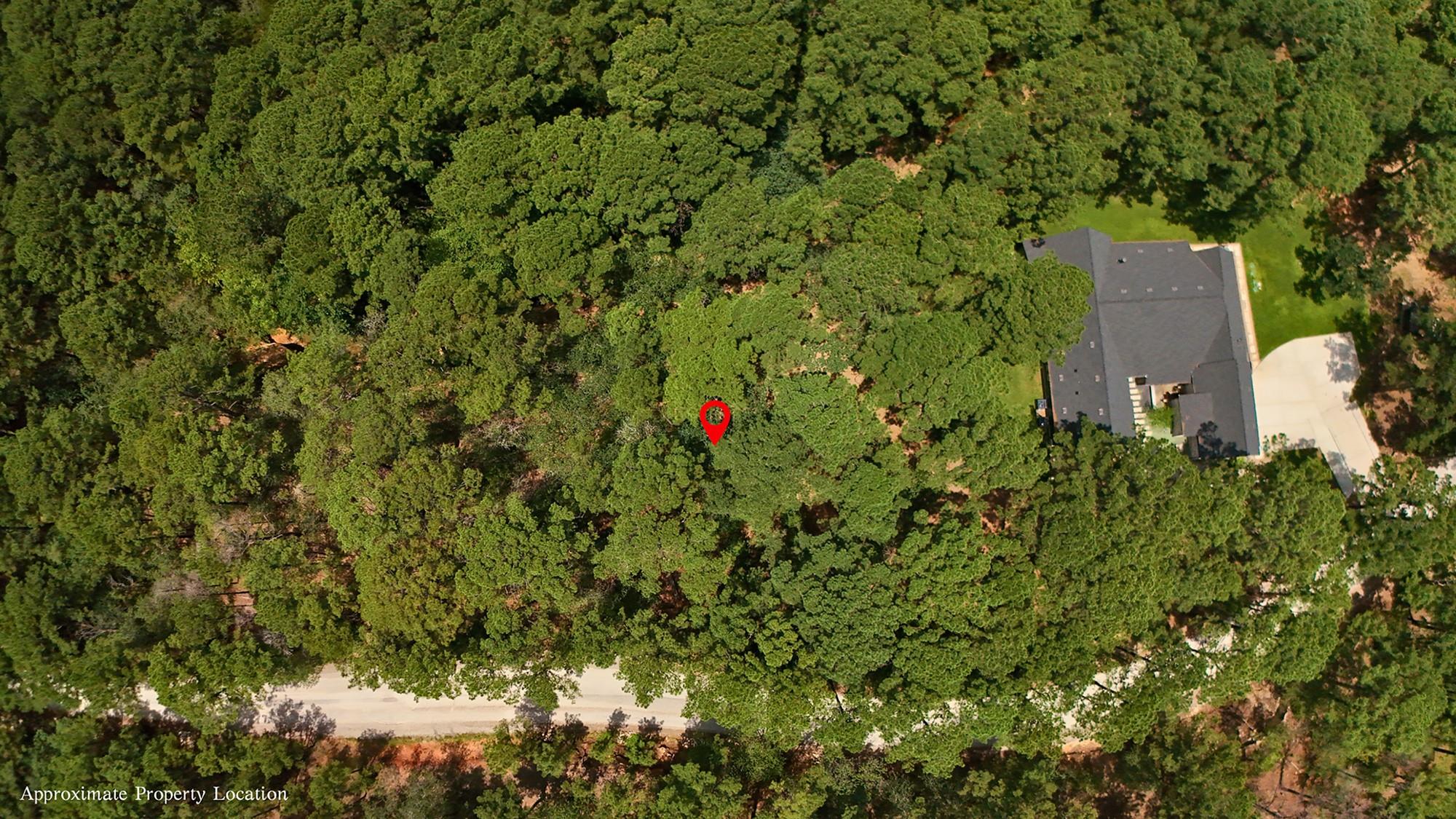 A tranquil wooded lot offers seclusion and natura