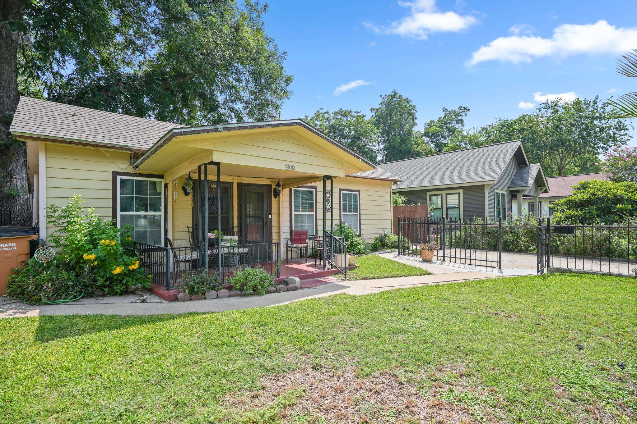 A charming bungalow with a welcoming front porch,