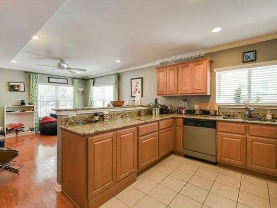 Granite counters and light wood cabinetry define 