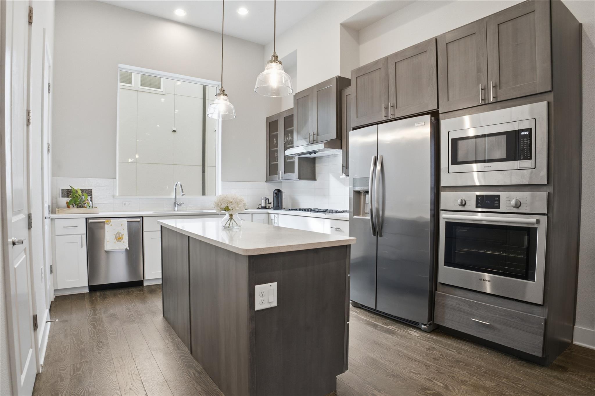 Modern kitchen with high ceilings and sleek integ
