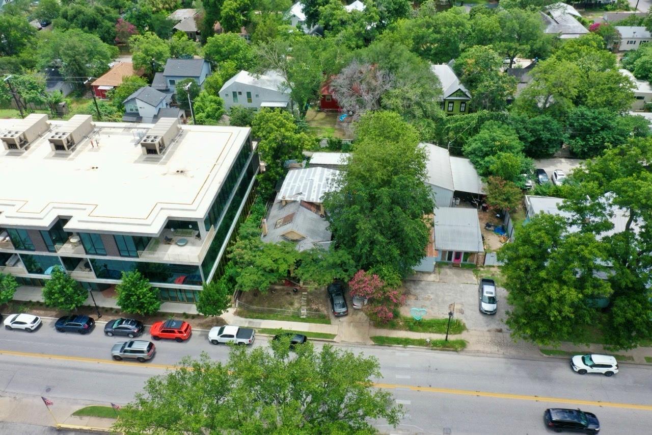 Mature trees surround the property, providing pri