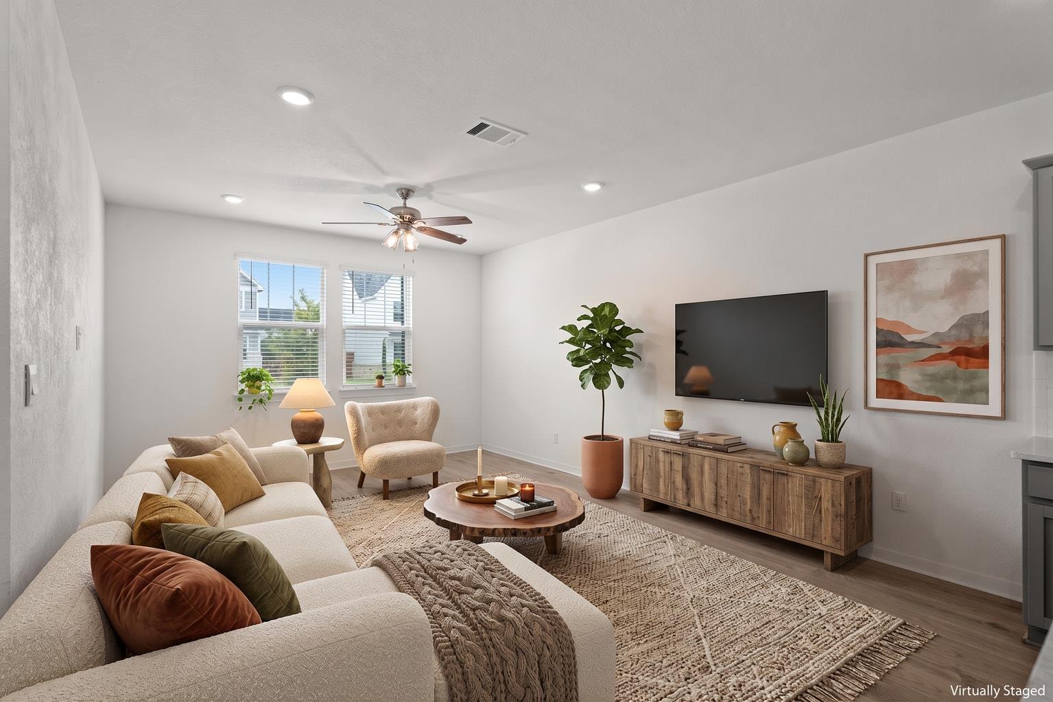 A well-lit living area features smooth flooring, 