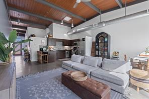 Exposed beam ceilings elevate this spacious open-
