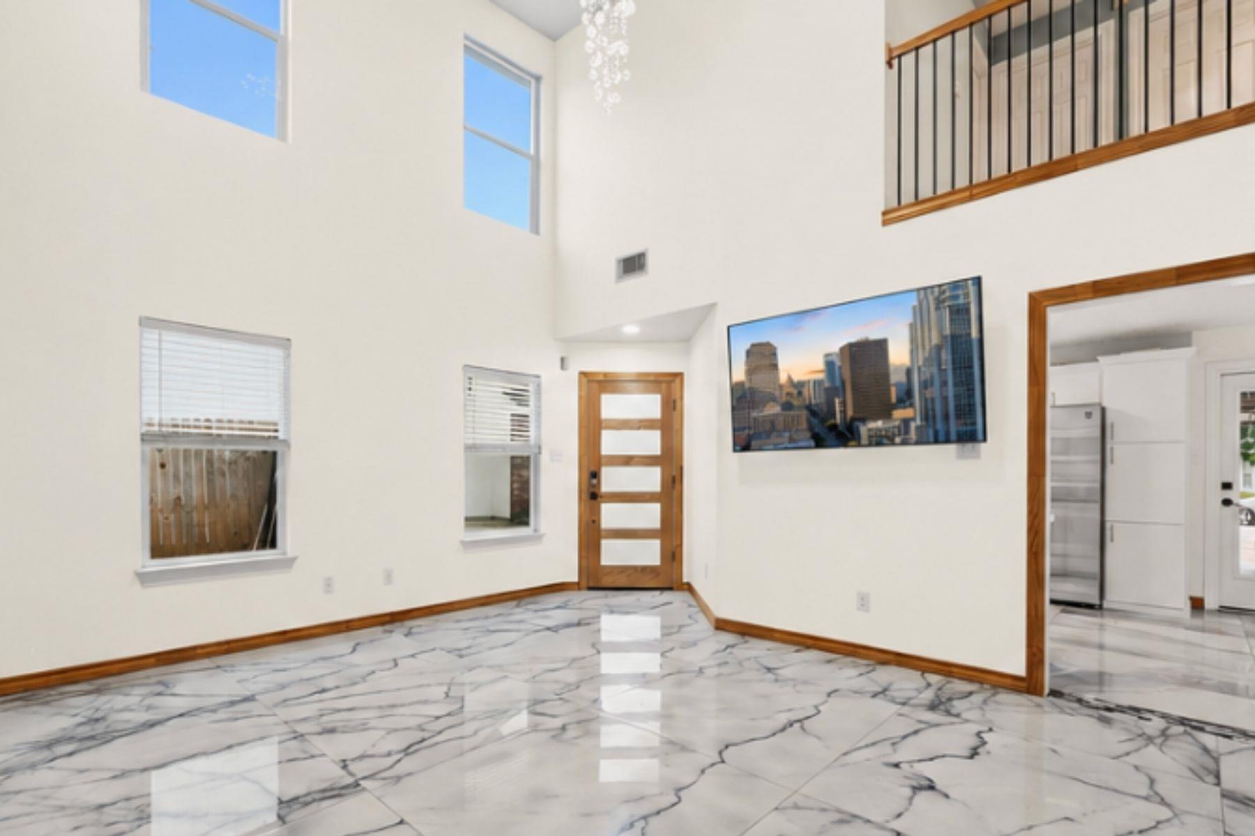 Gleaming marble floors and soaring ceilings defin