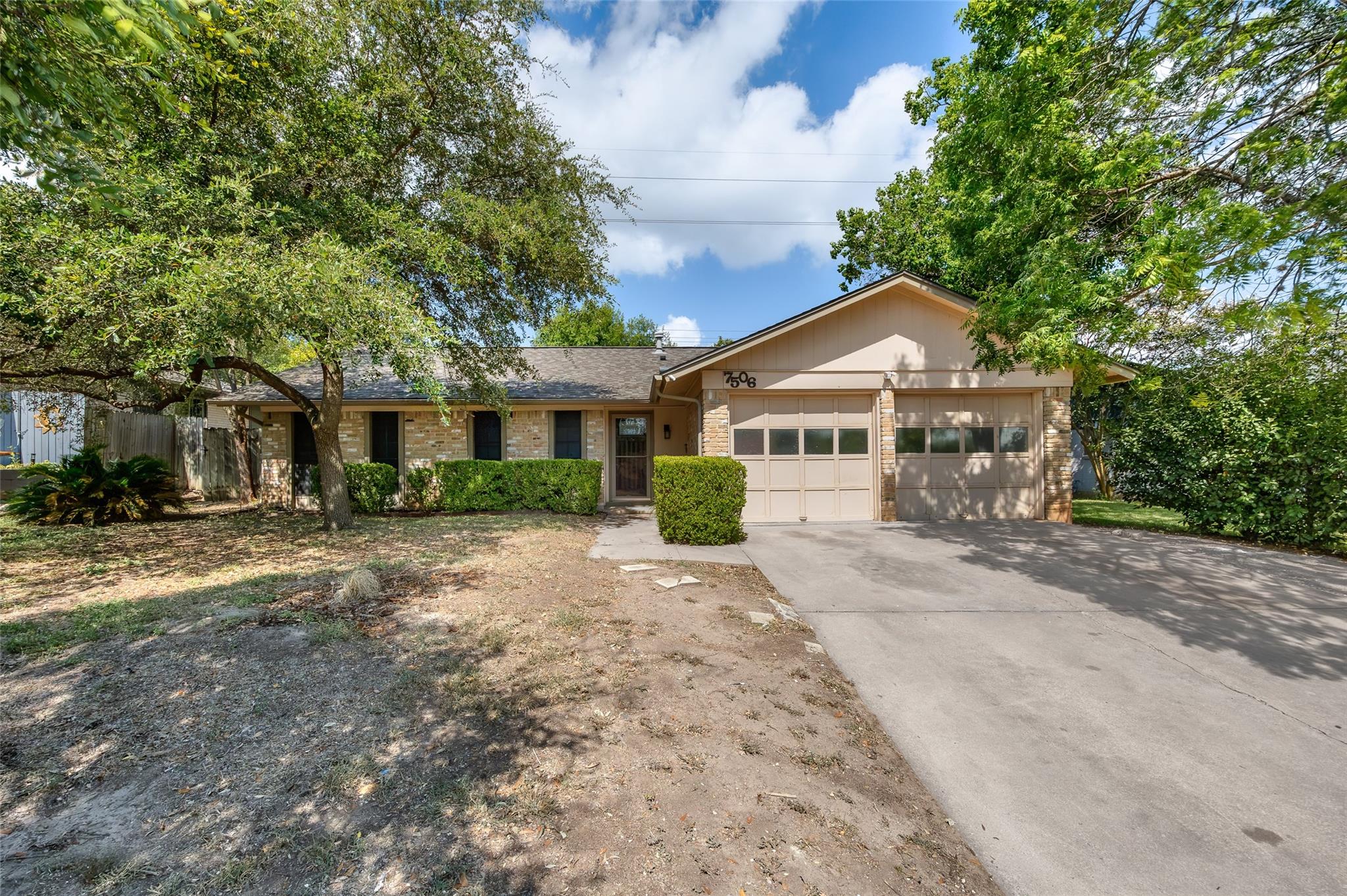 A classic ranch-style home features an attached g