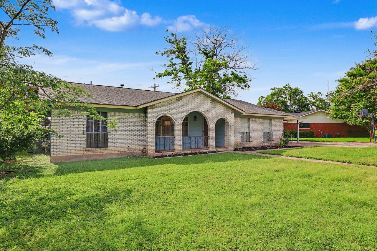 A well-maintained lawn welcomes you to this singl