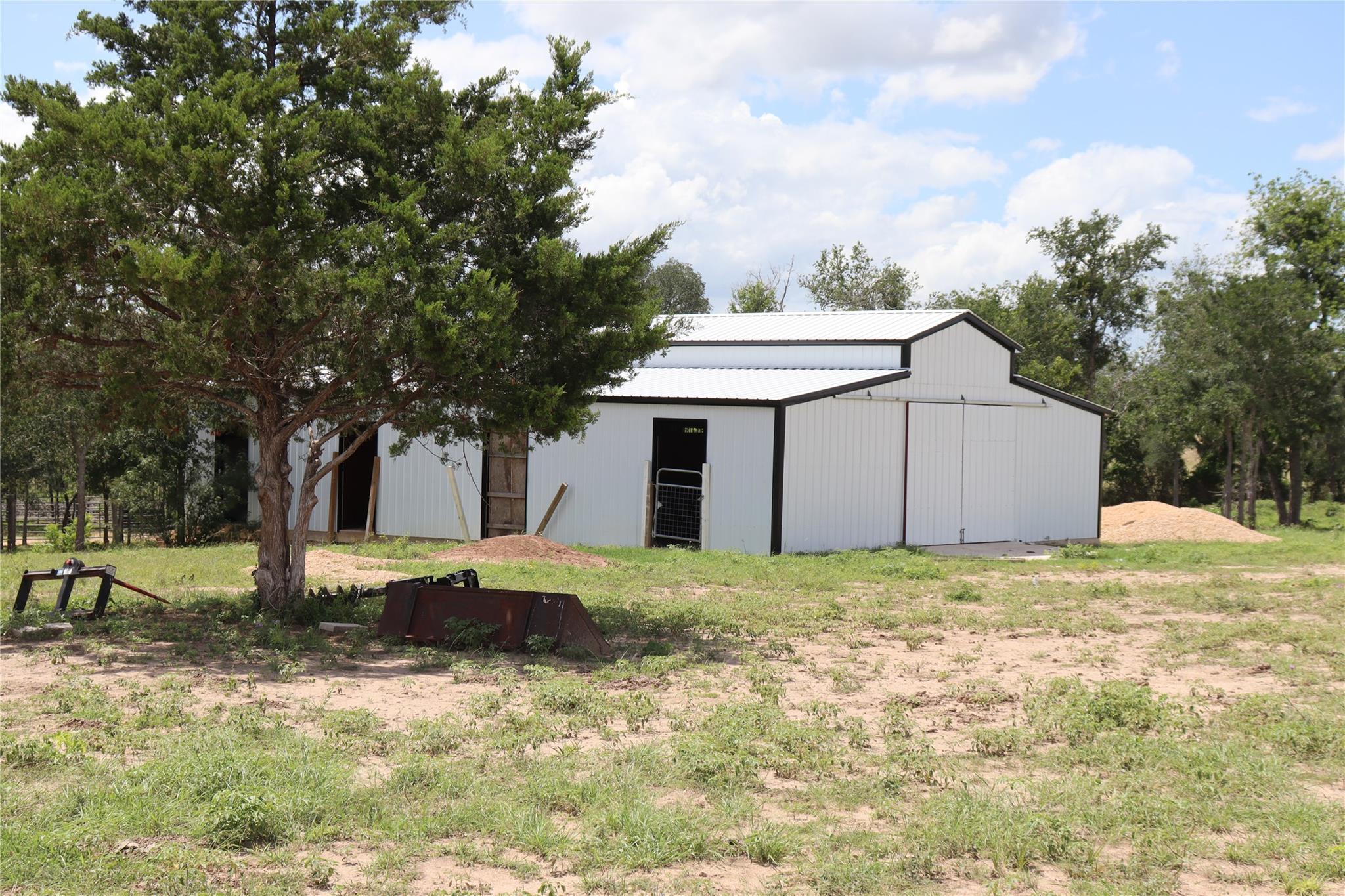 A well-maintained barn with pristine white siding
