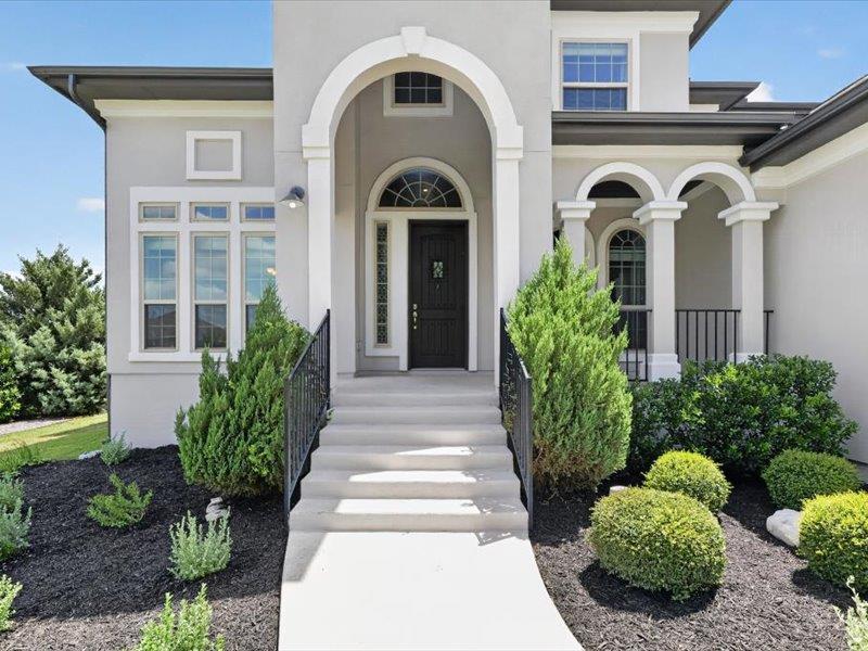 An inviting entry showcases architectural arches 