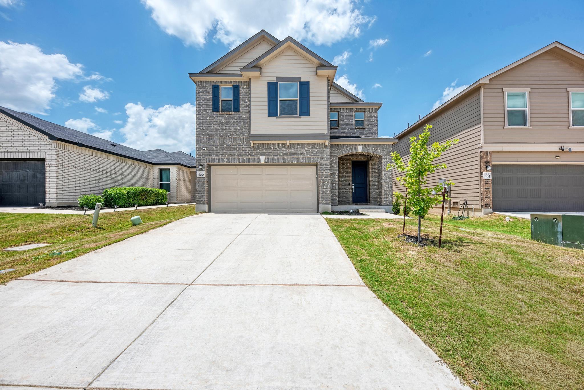 A well-maintained two-story home with a wide conc