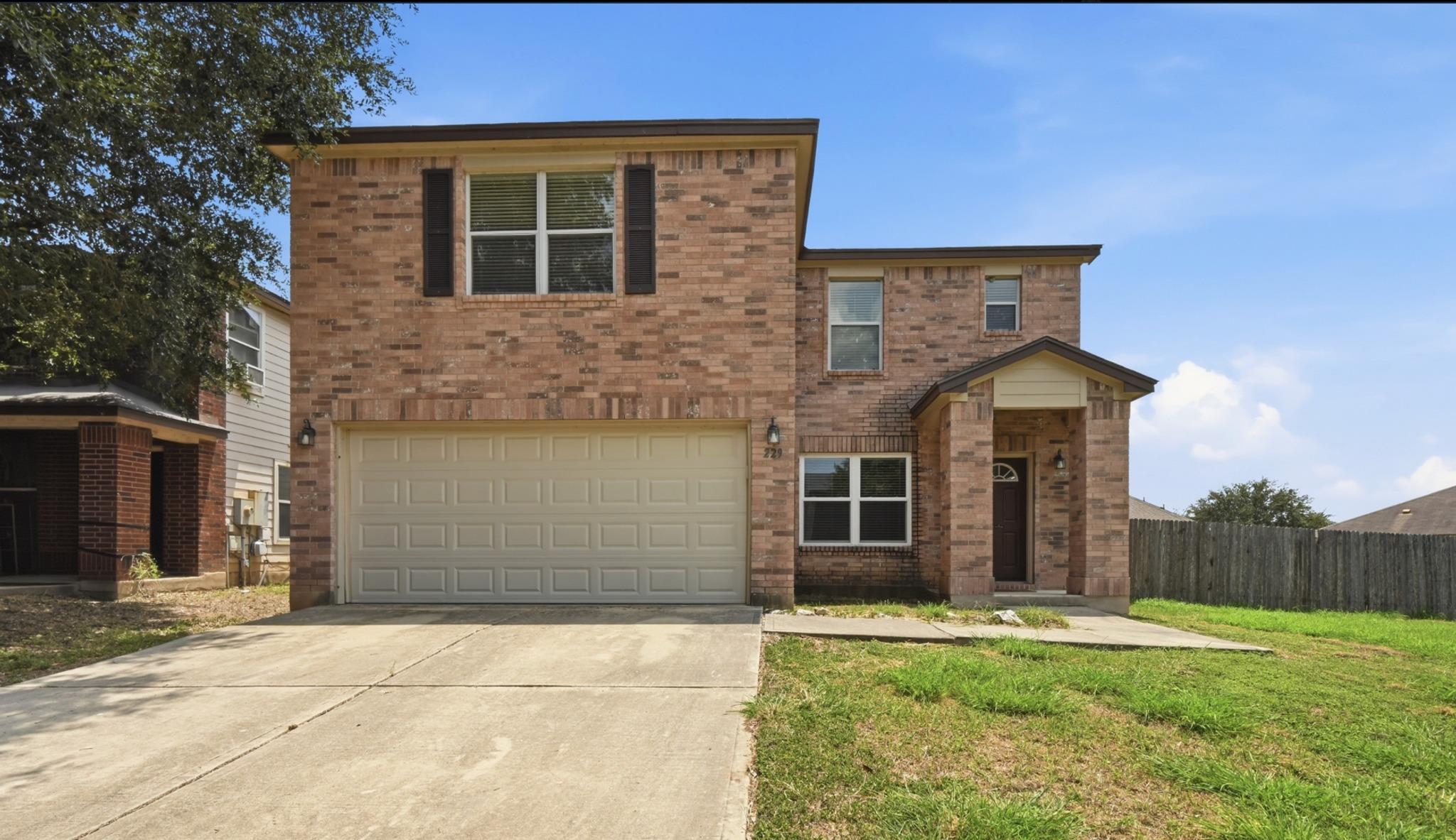 Brick facade with a welcoming covered entry and a