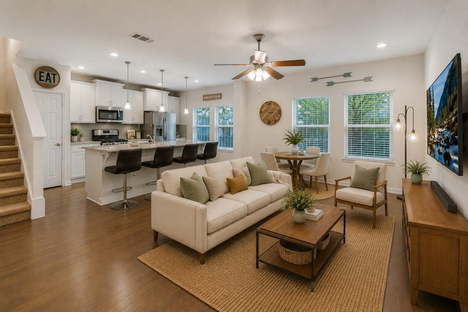 An open-concept living area boasts a modern kitch