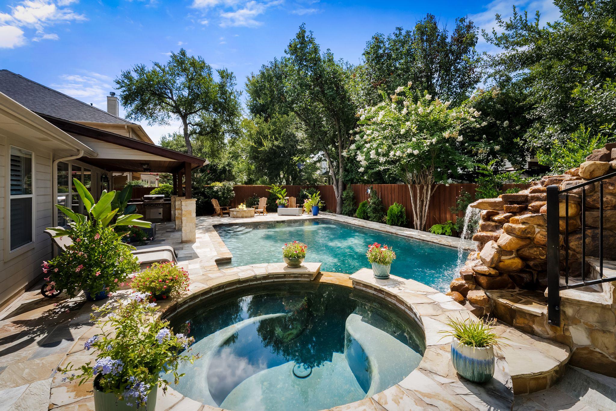 An inviting backyard oasis offers a sparkling poo