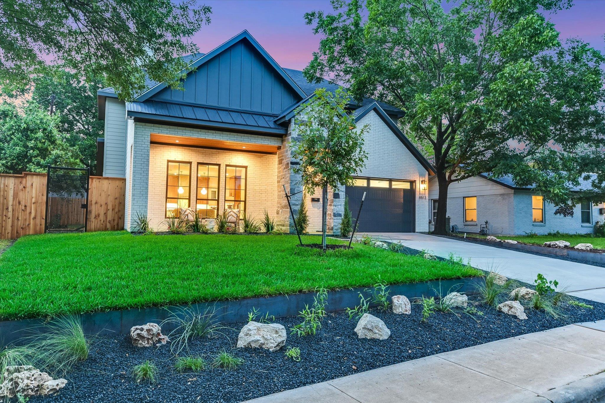 Modern architecture meets lush landscaping in thi
