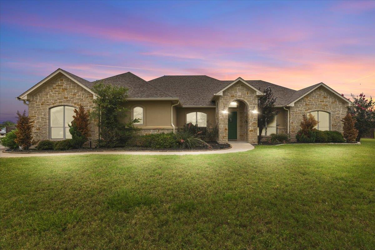 A graceful stone and stucco exterior, set against