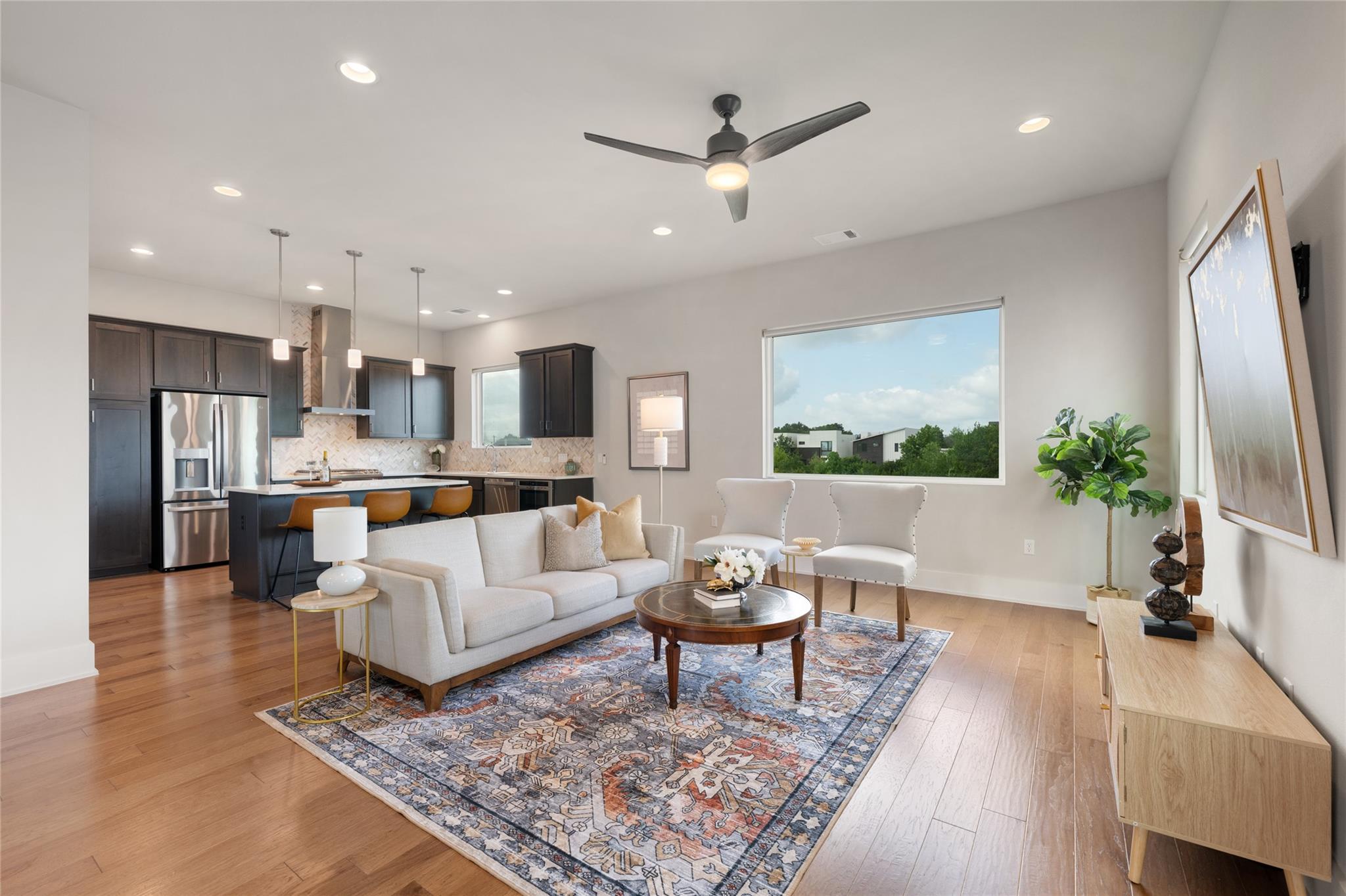 An open concept living area seamlessly connects t