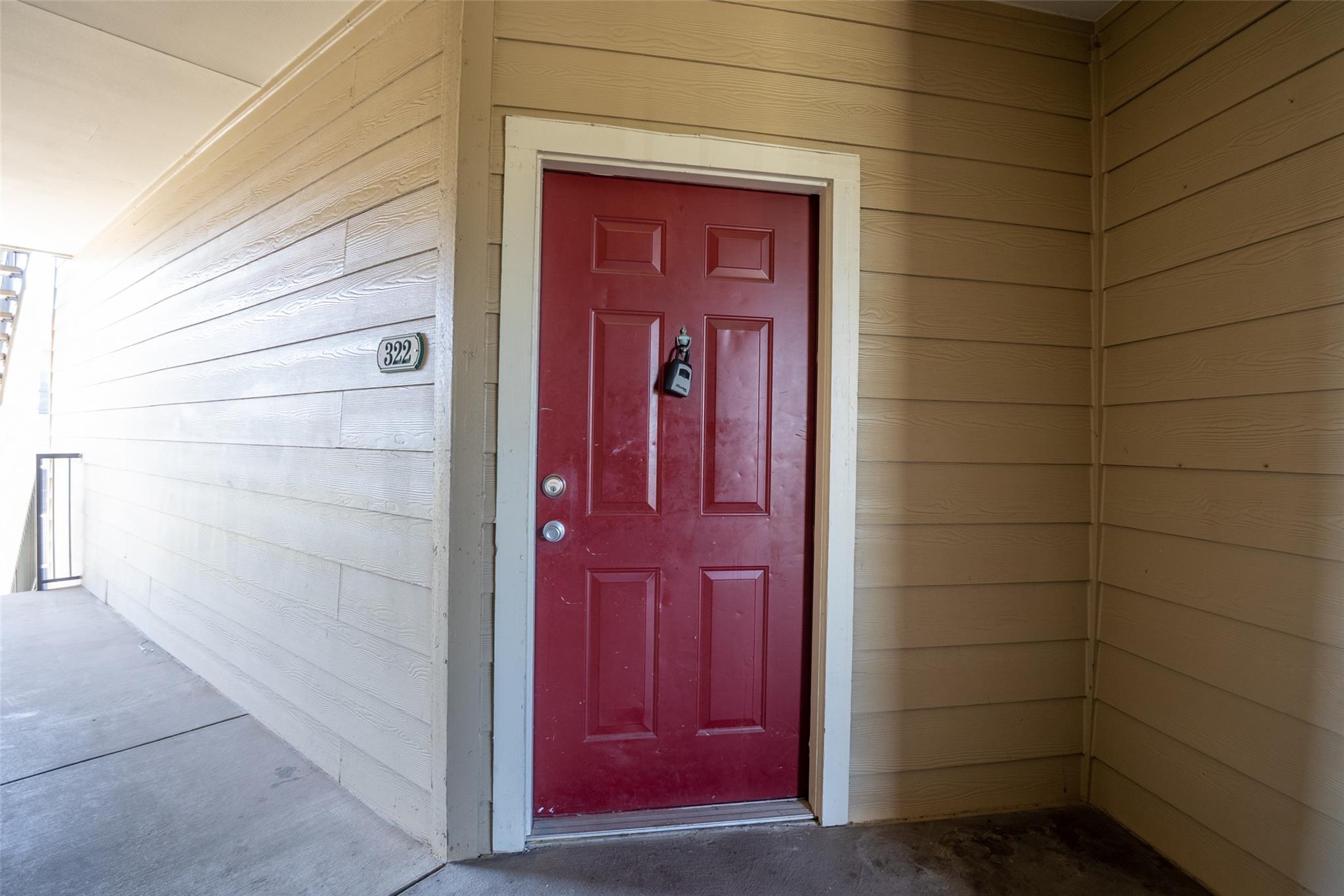 A vibrant red door welcomes you into this propert