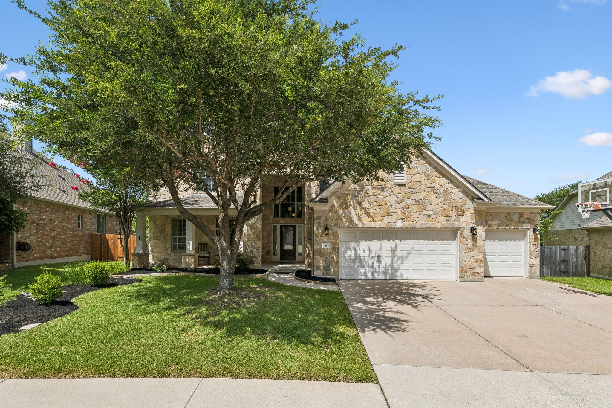 A spacious stone facade residence with a well-mai