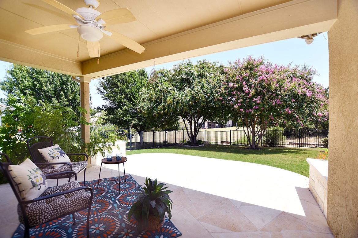 Stone pavers line a covered patio overlooking the