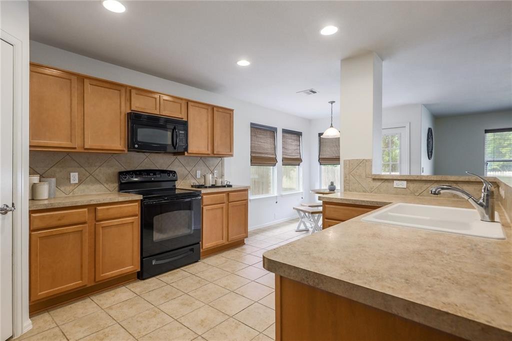 A well-appointed kitchen featuring a functional l
