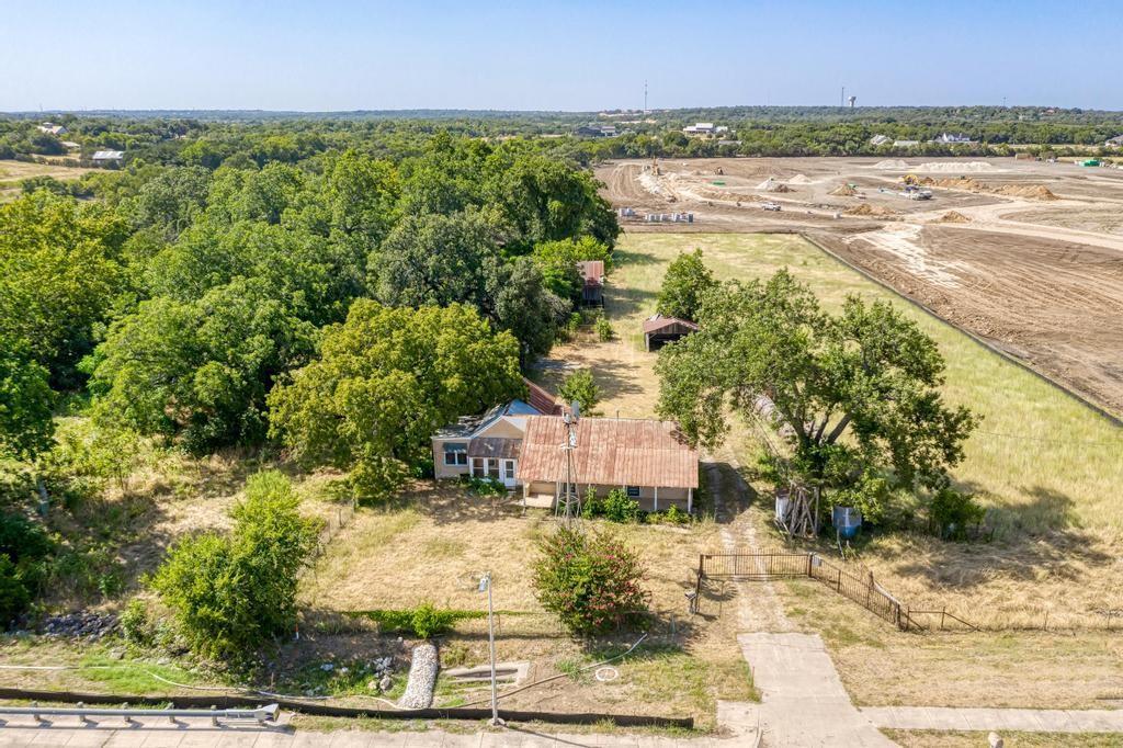 A rural retreat with a rustic residence, mature t