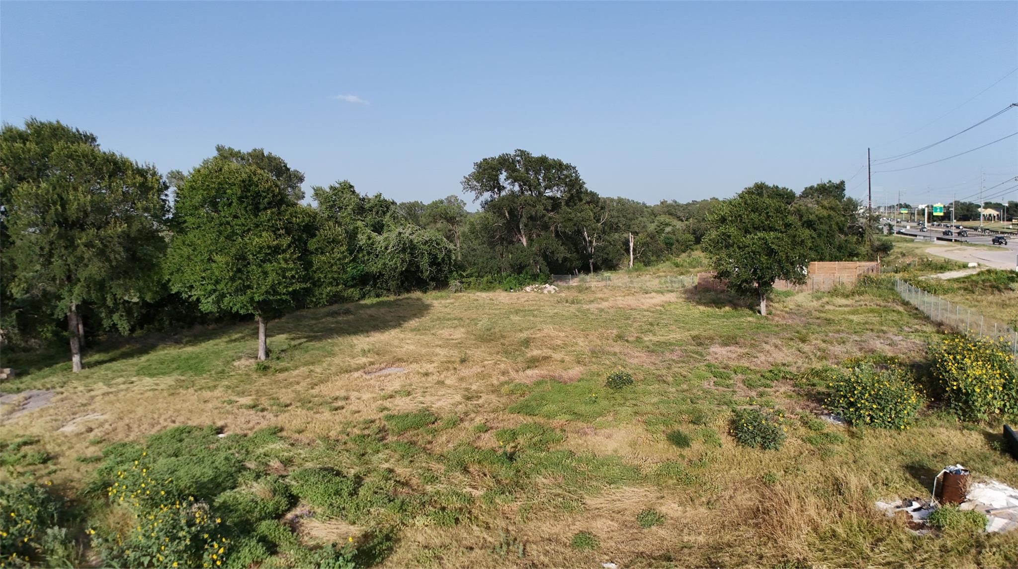 A spacious, buildable lot provides direct highway