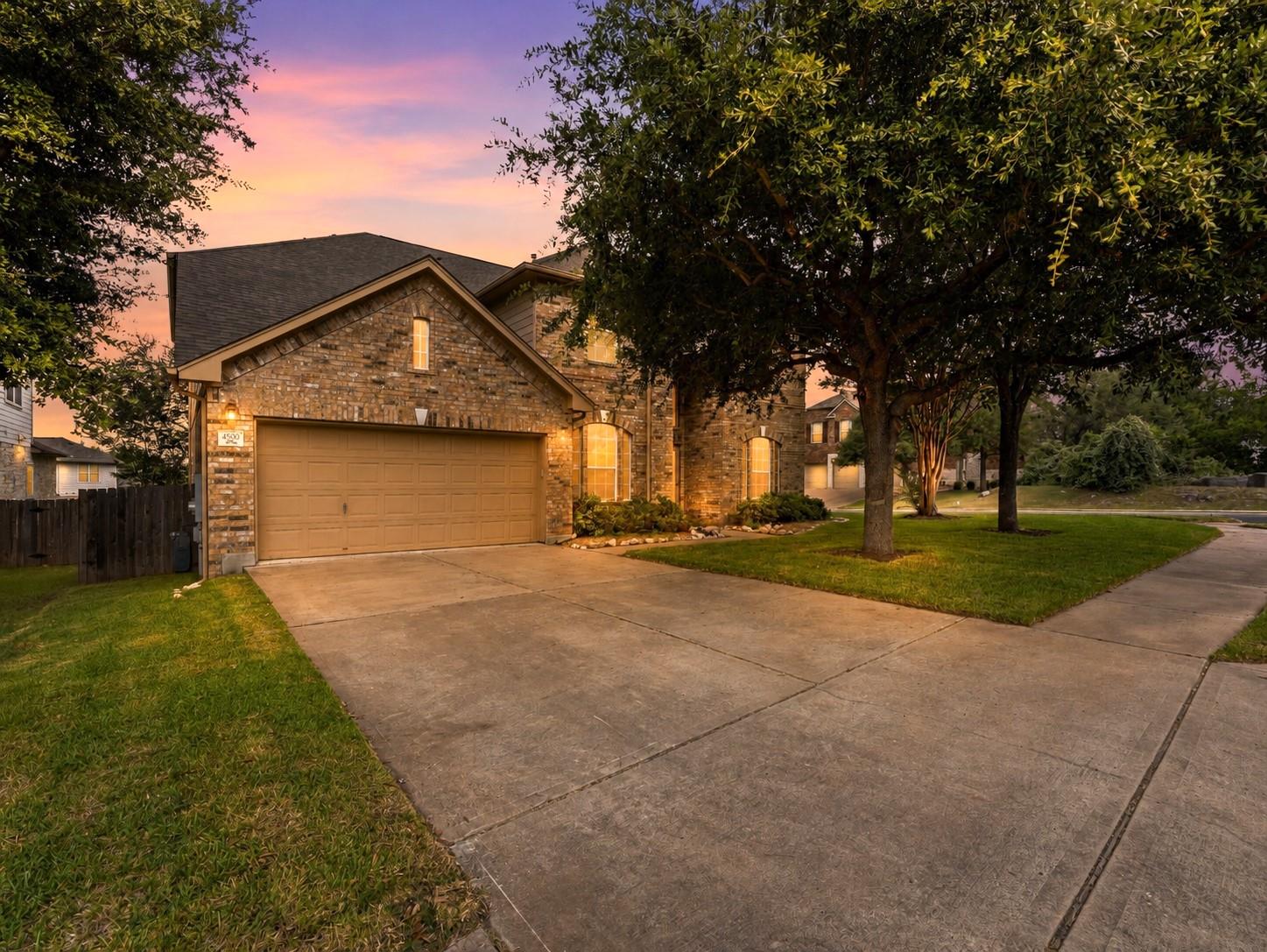 A classic brick facade welcomes you home, complem