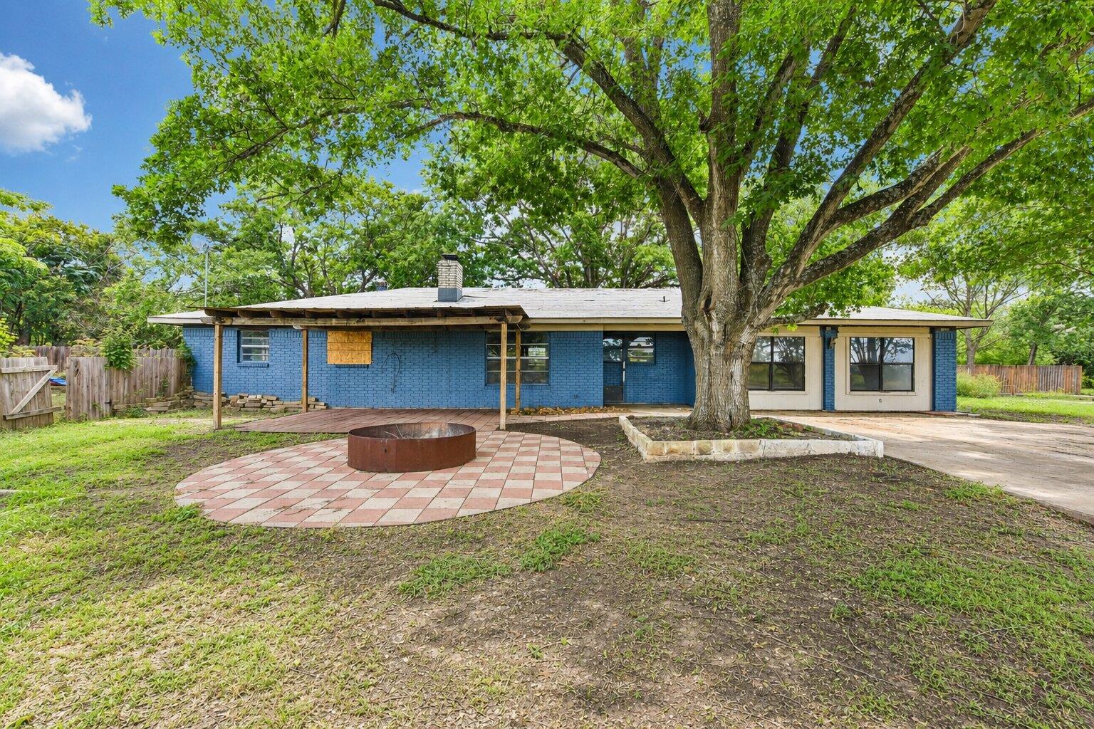 Mature trees shade this charming residence, offer