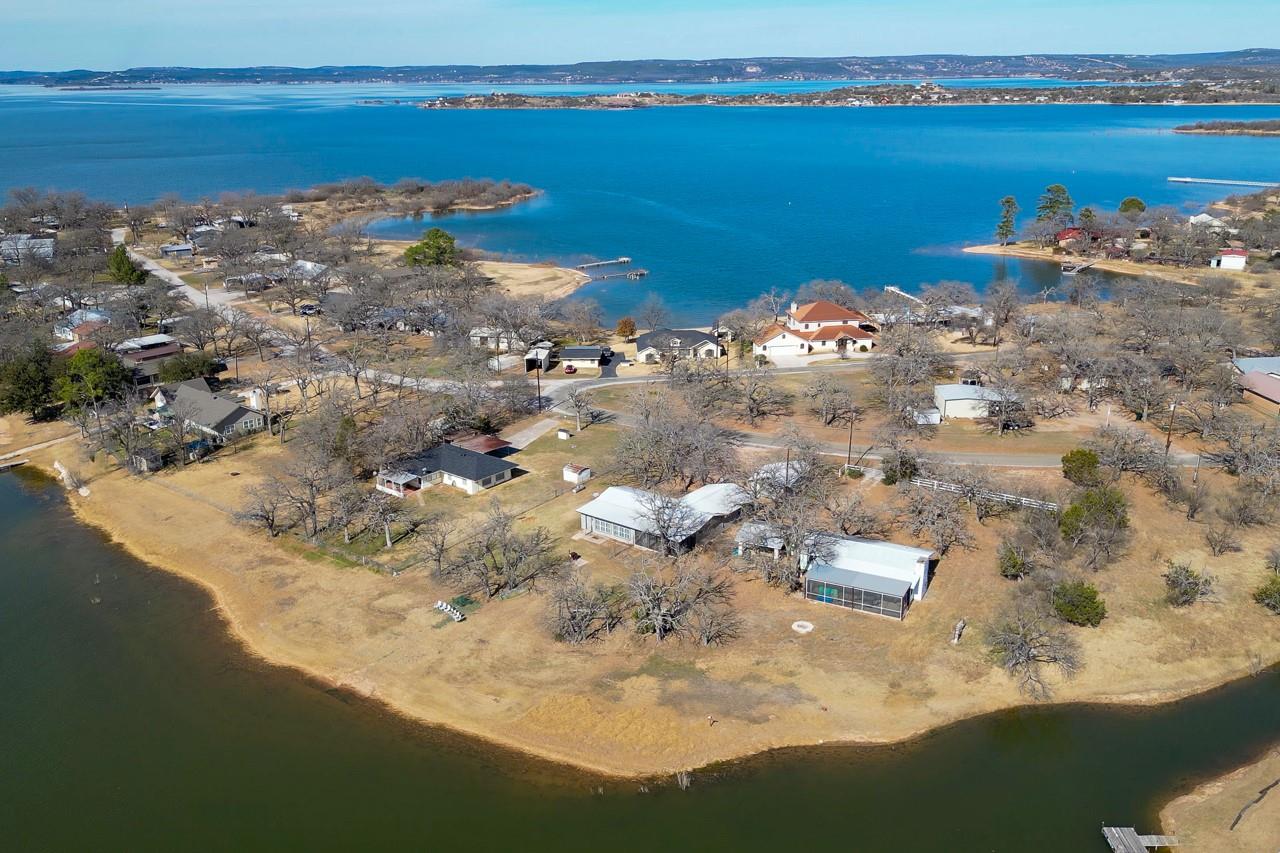 Perched on a peninsula, this lakeside property of