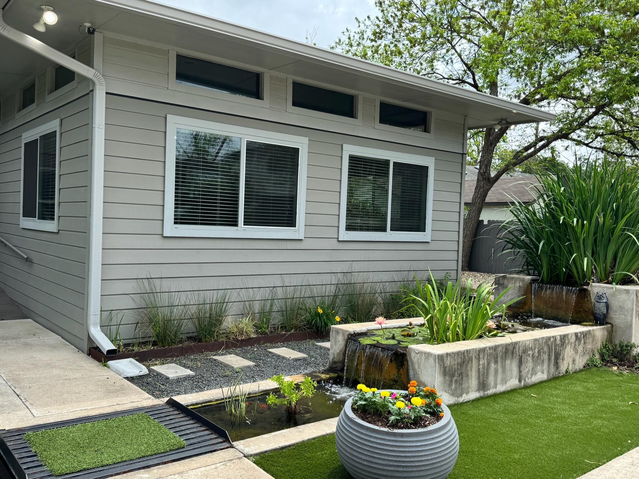 A tranquil outdoor space with lush greenery and a