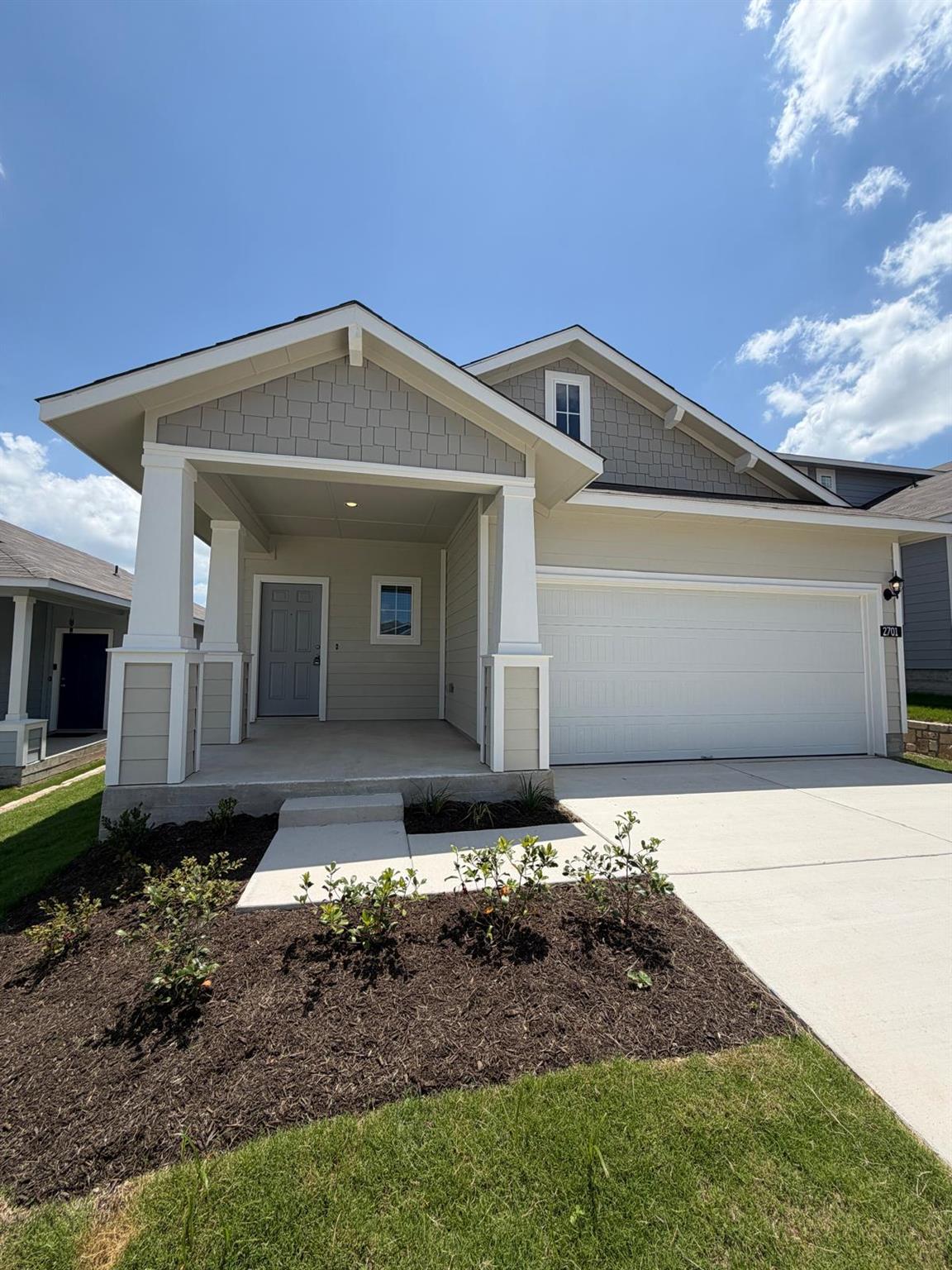 A welcoming covered porch and meticulously mainta