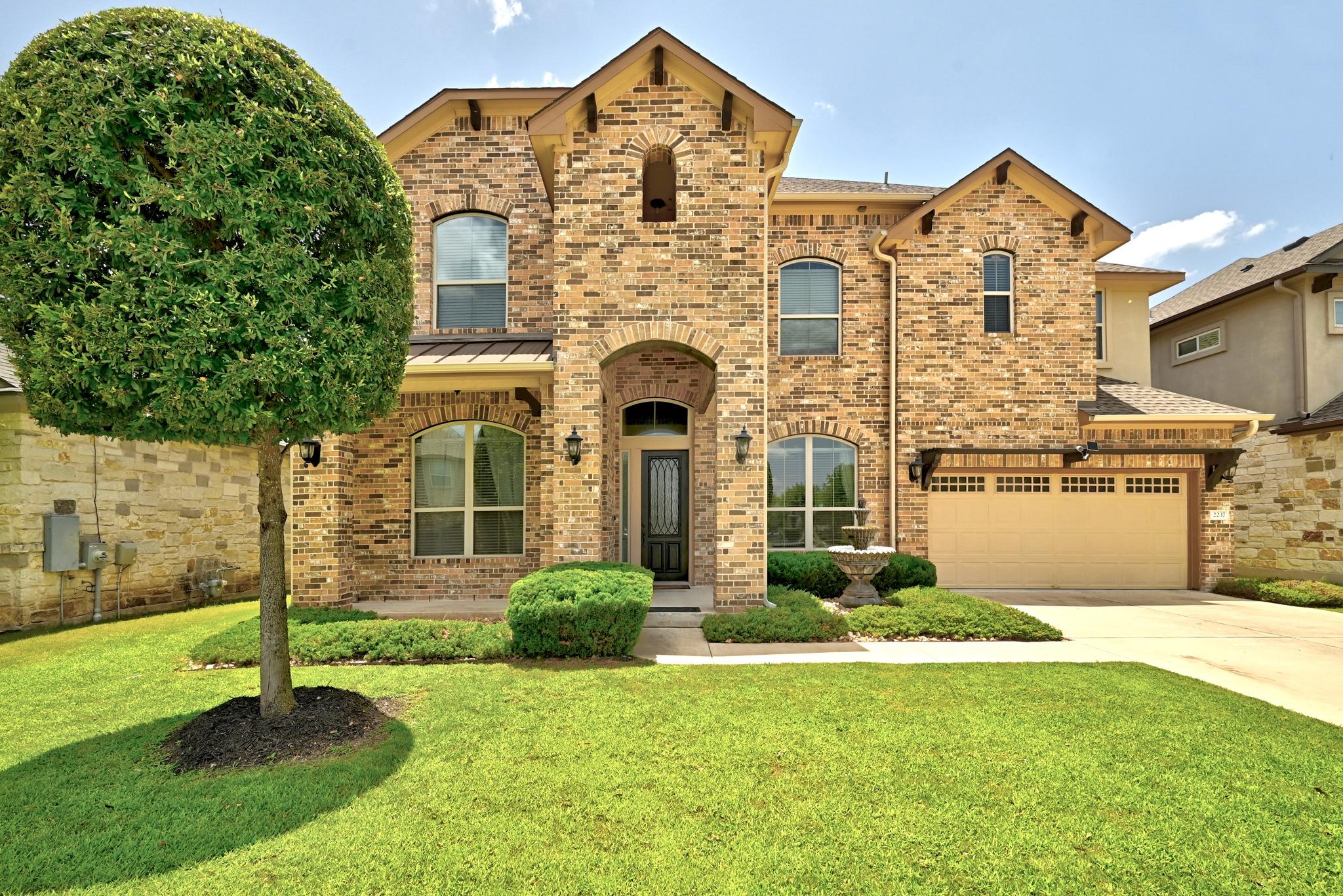 A classic brick facade with arched windows and a 