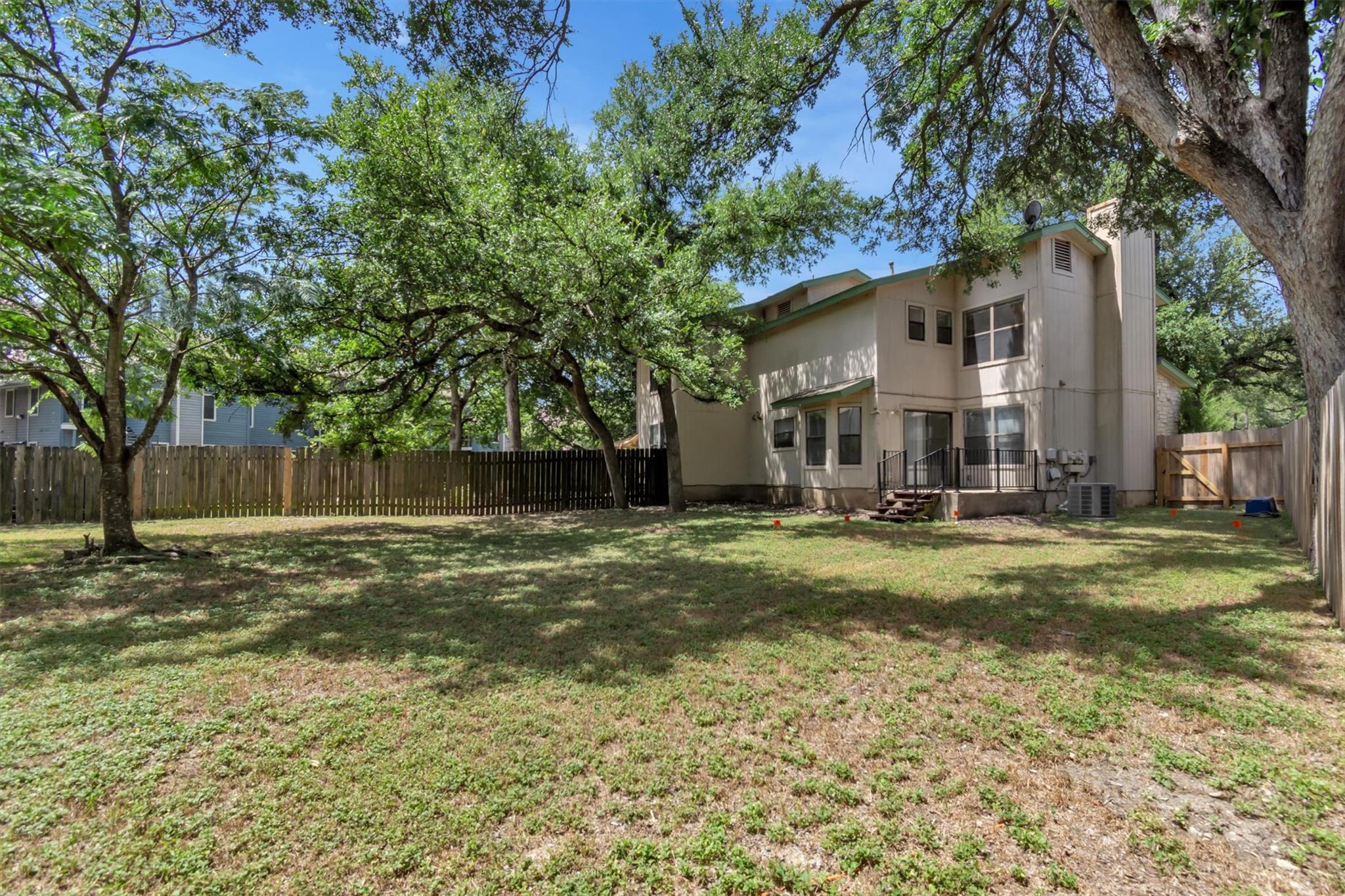 A spacious backyard provides ample green space fo