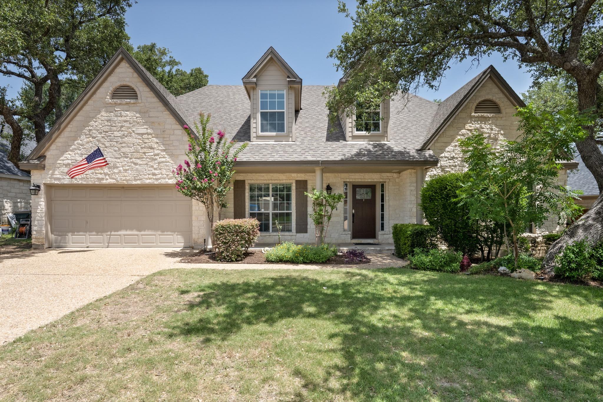 A classic facade of stone and siding greets with 