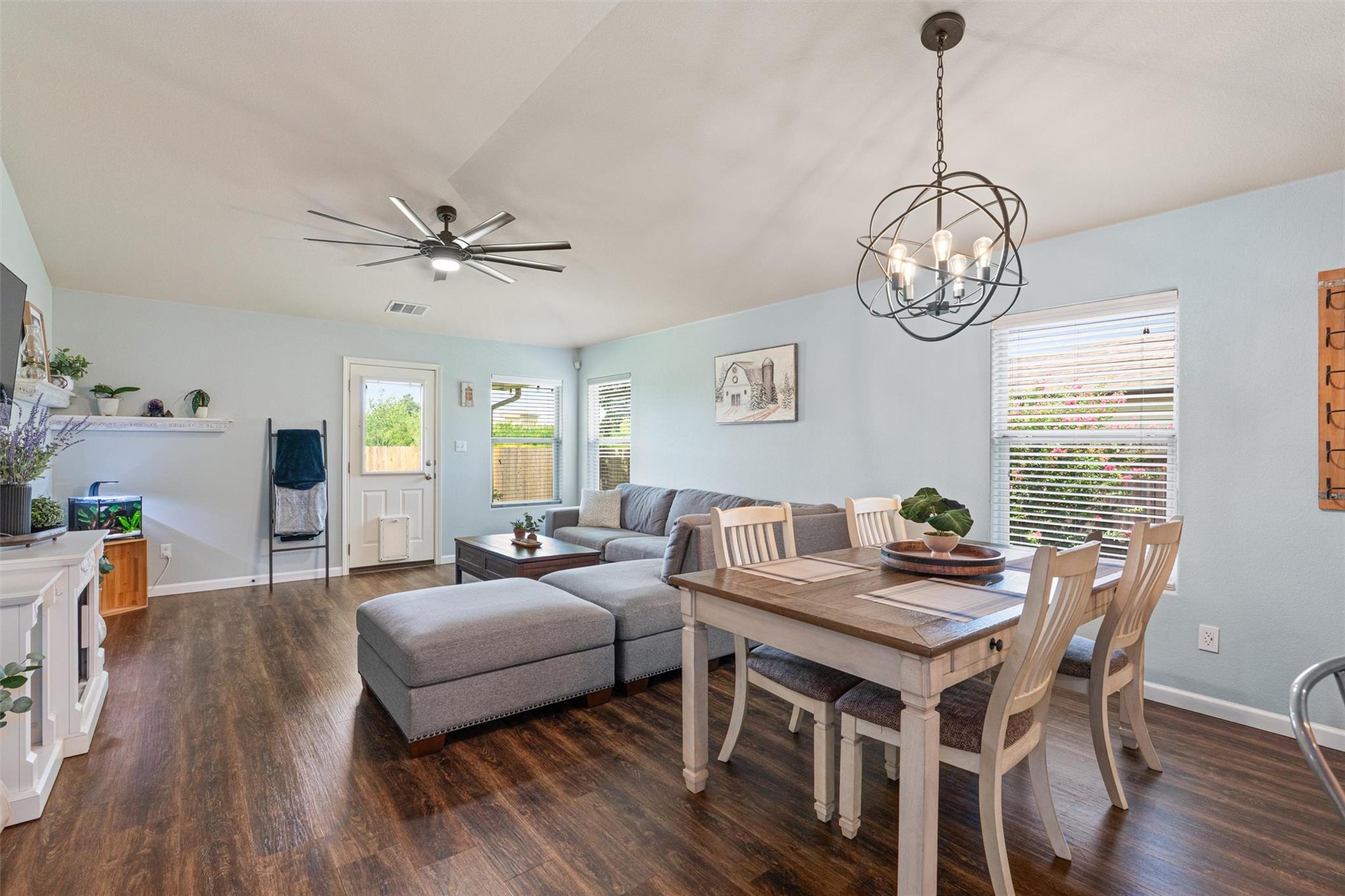 This airy open-concept living space features warm
