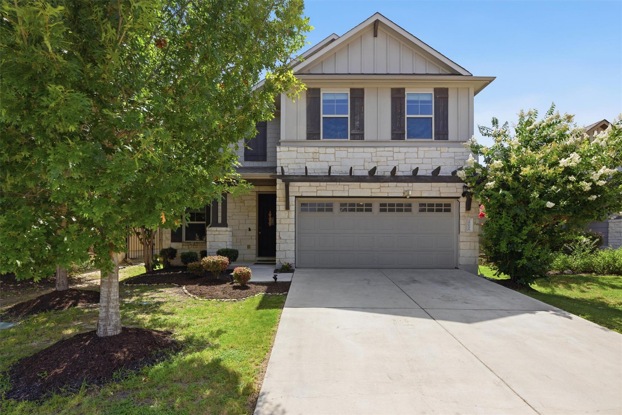 A charming stone and siding facade welcomes you, 