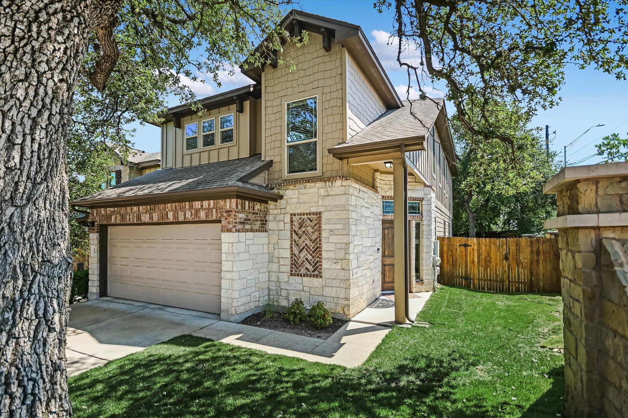 A well-maintained lawn and mature tree enhance th
