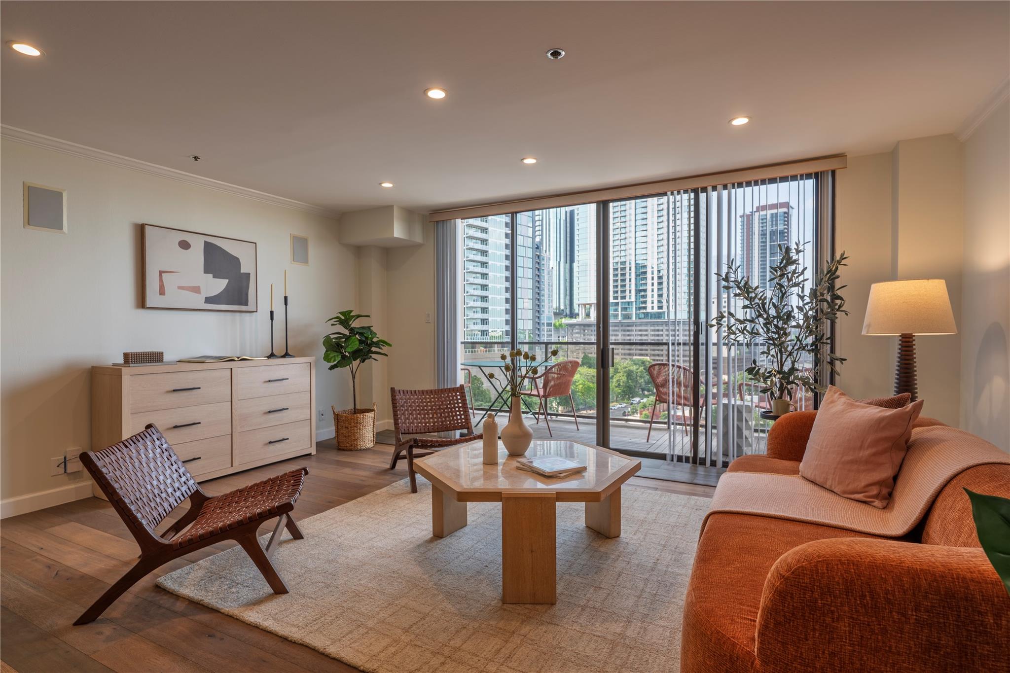 City views frame this inviting living area, compl
