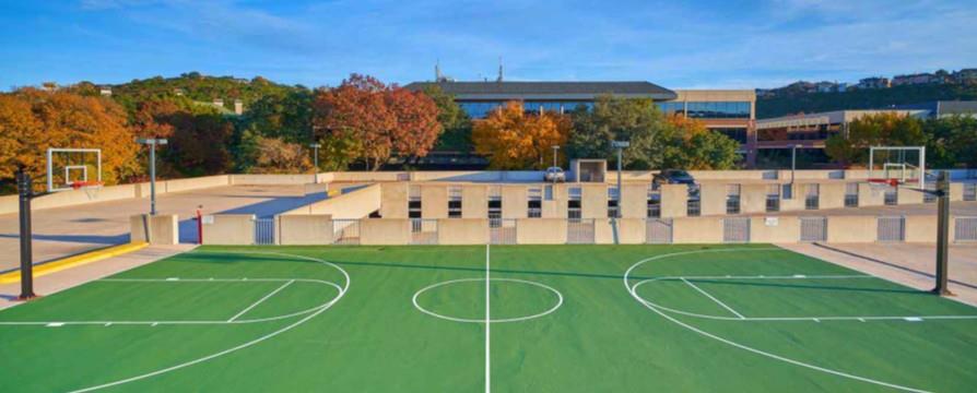 An outdoor basketball court offers ample recreati