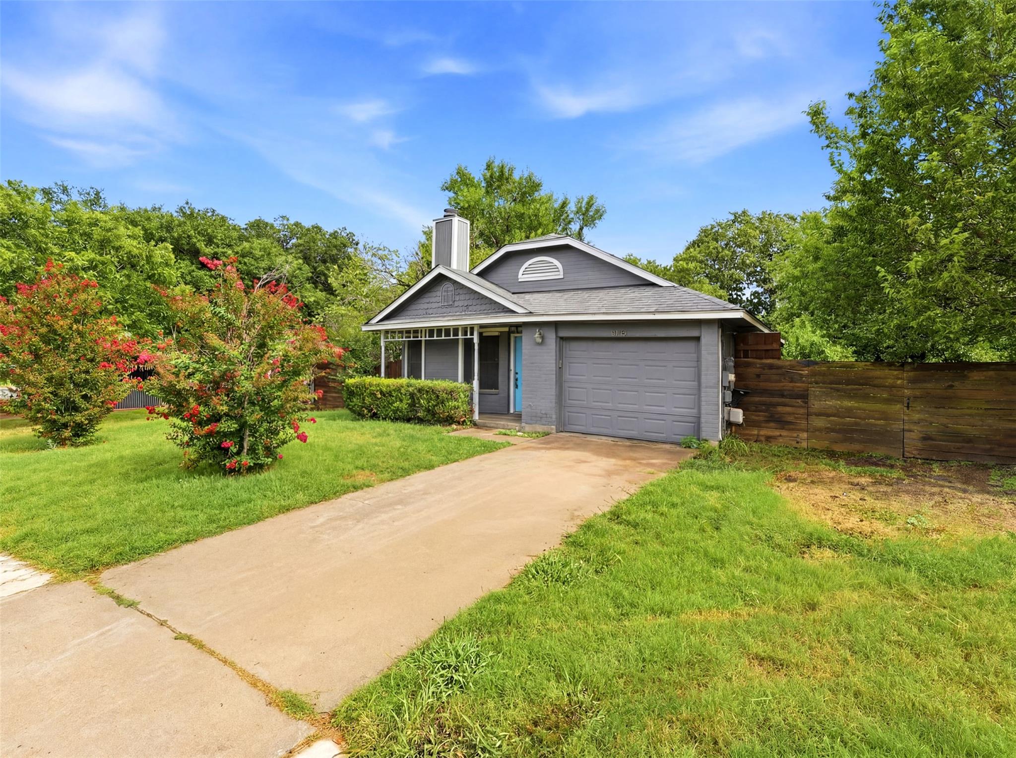 A charming exterior with a classic gray facade an
