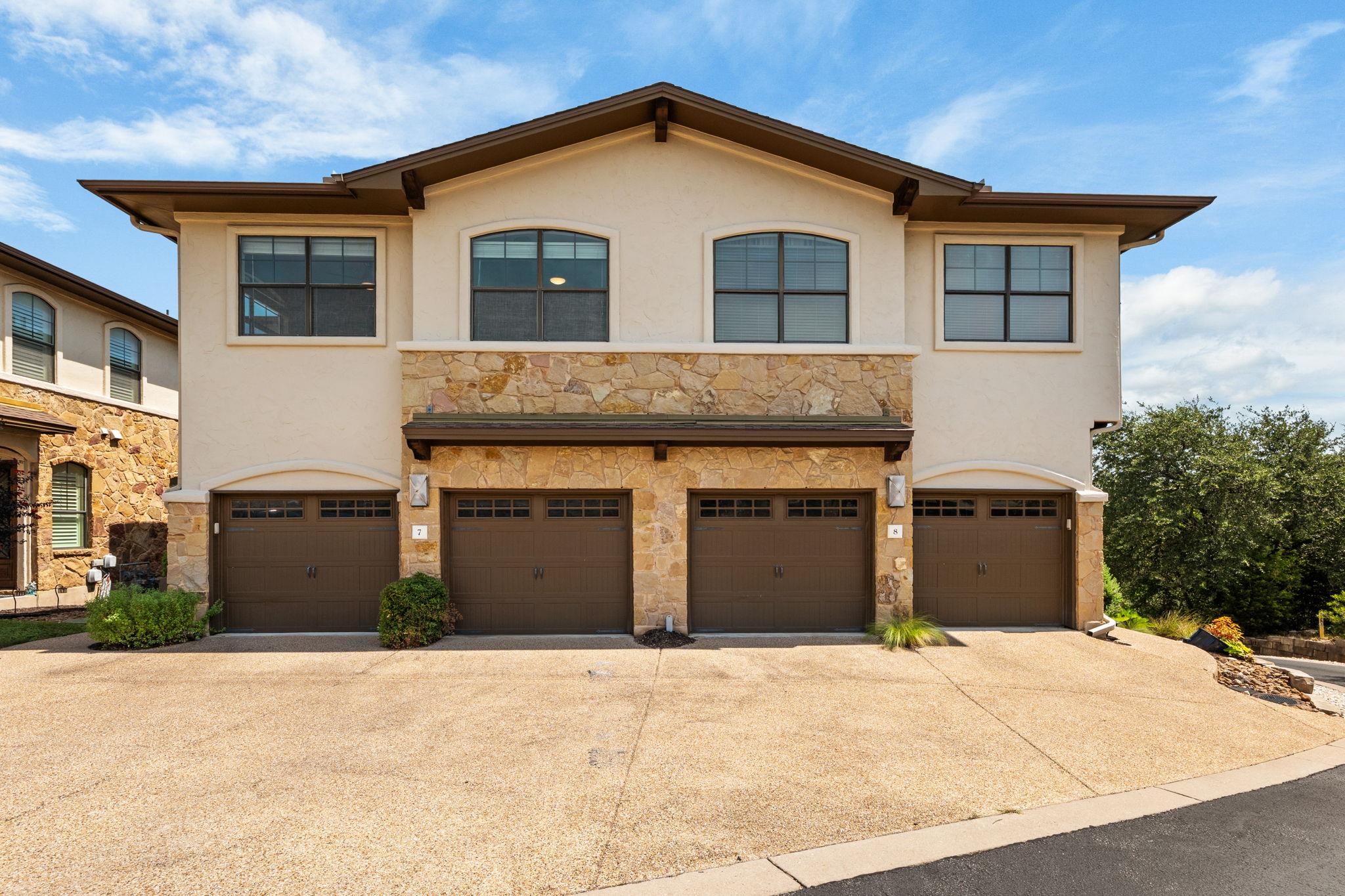 A striking exterior featuring stone accents, arch