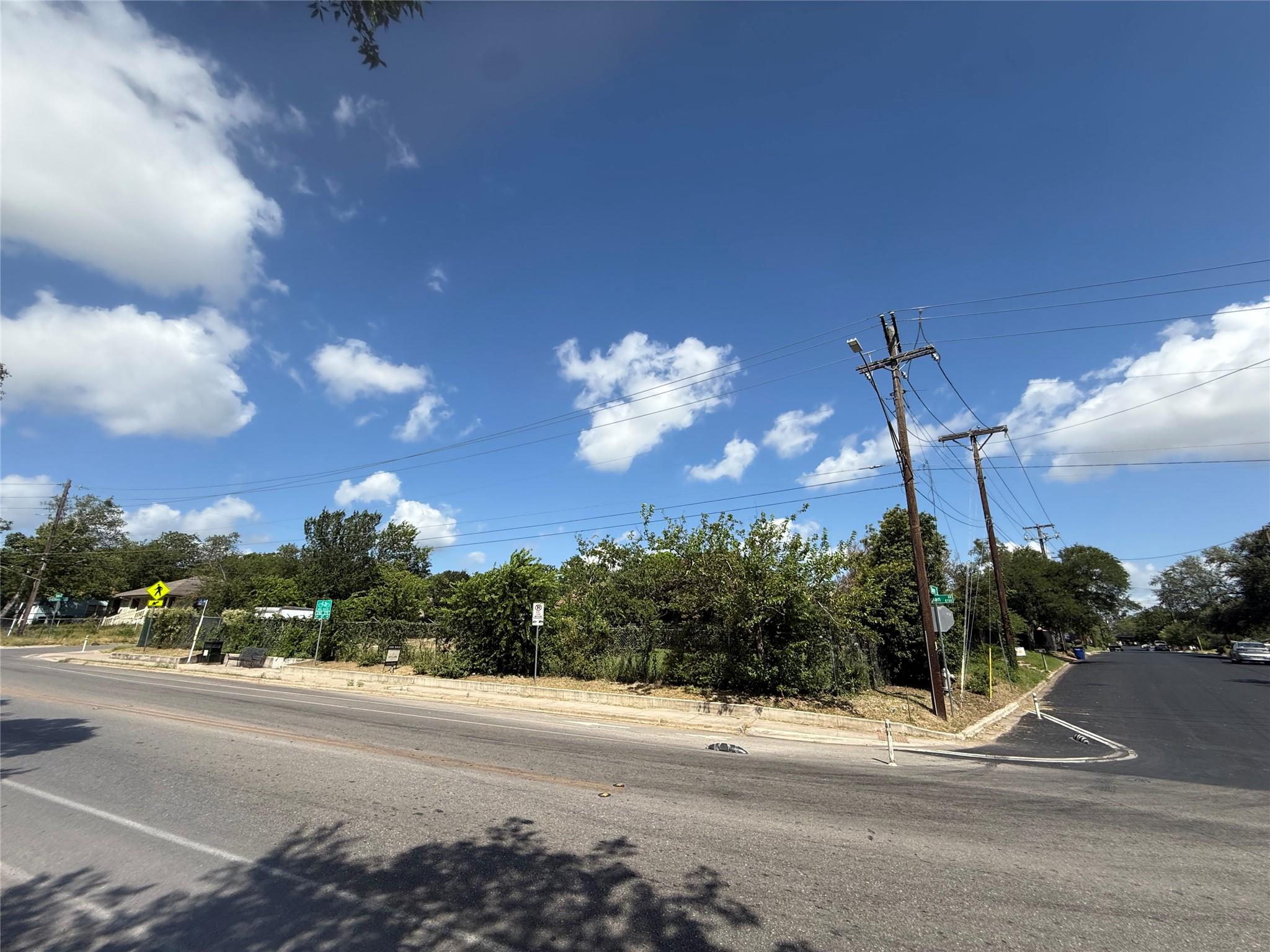 A promising corner lot offers ample development p