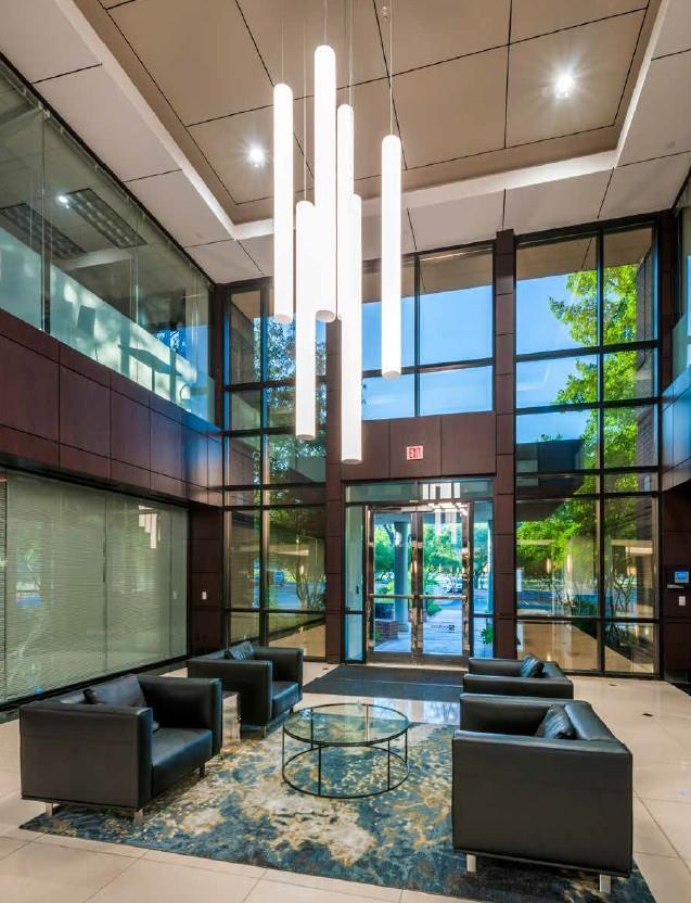 Step into a luminous lobby, where soaring ceiling